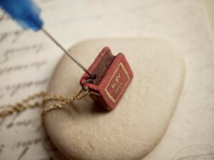 Dark Academia_ Secret Pages Vintage Book Ceramic Diffuser Necklace